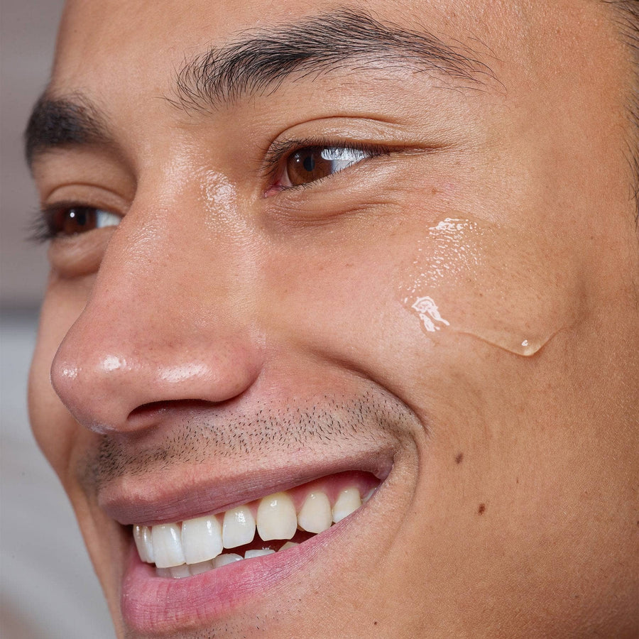 Young man with with Gentle Hydra-Gel Face Cleanser on his cheek