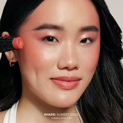 Asian young woman wearing Nudies Matte Glow Core in shade Sunset Gold