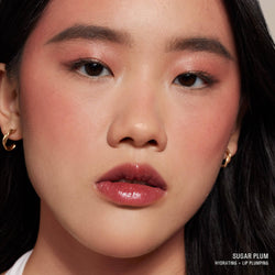 Asian Young woman wearing Hydra-Peptide Lip Butter in shade Sugar Plum