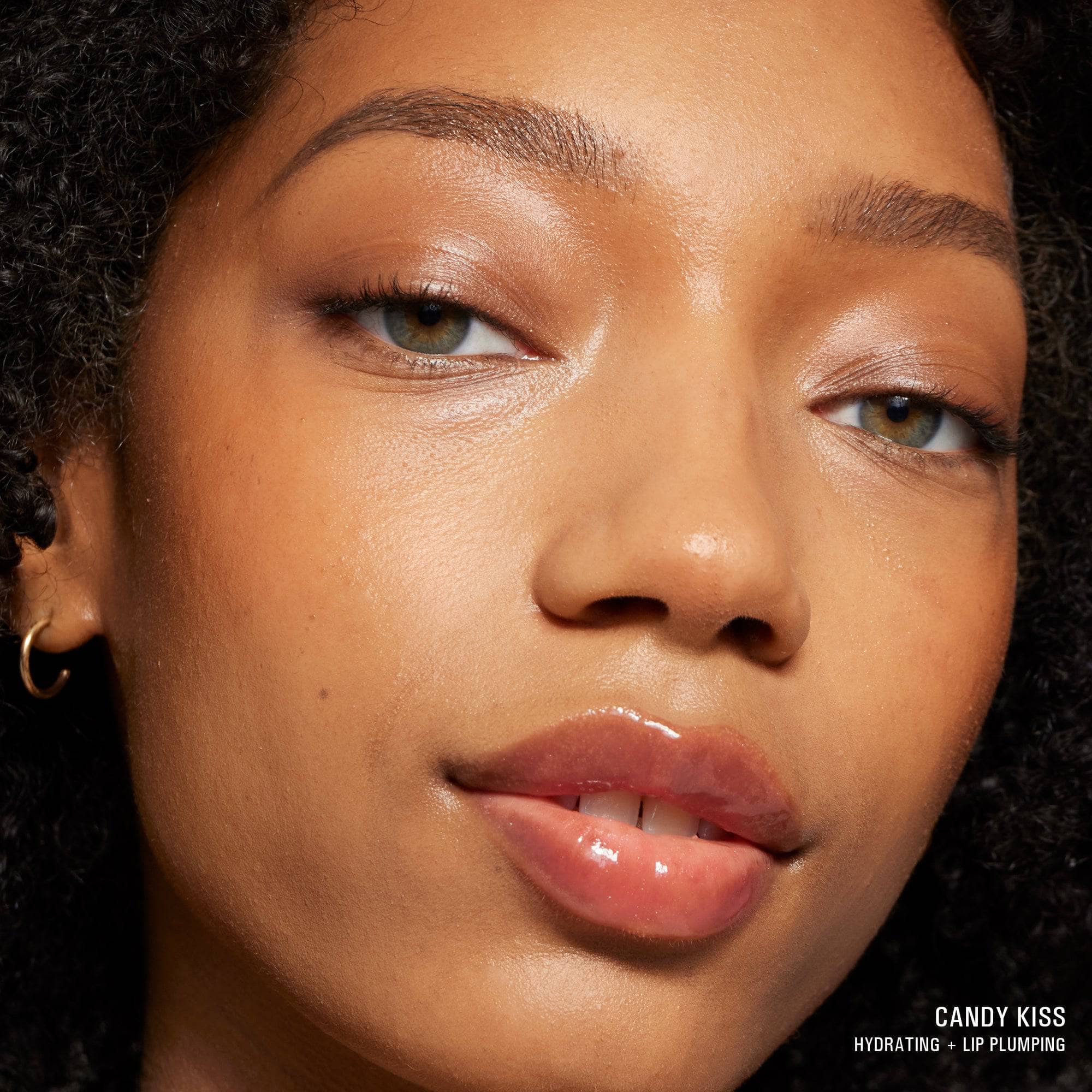 Mixed race young woman wearing Hydra-Peptide Lip Butter in shade Candy Kiss