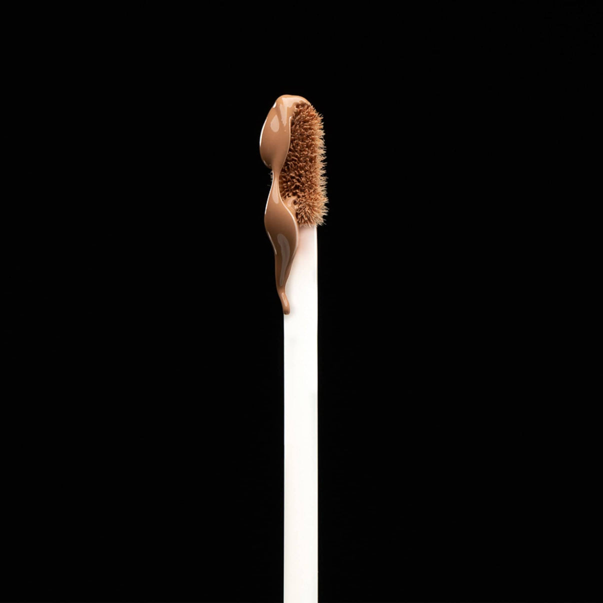 Nudefix cream concealer in shade nude 4.5 brush with product
