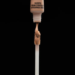 Nudefix cream concealer in shade nude 4 brush with product