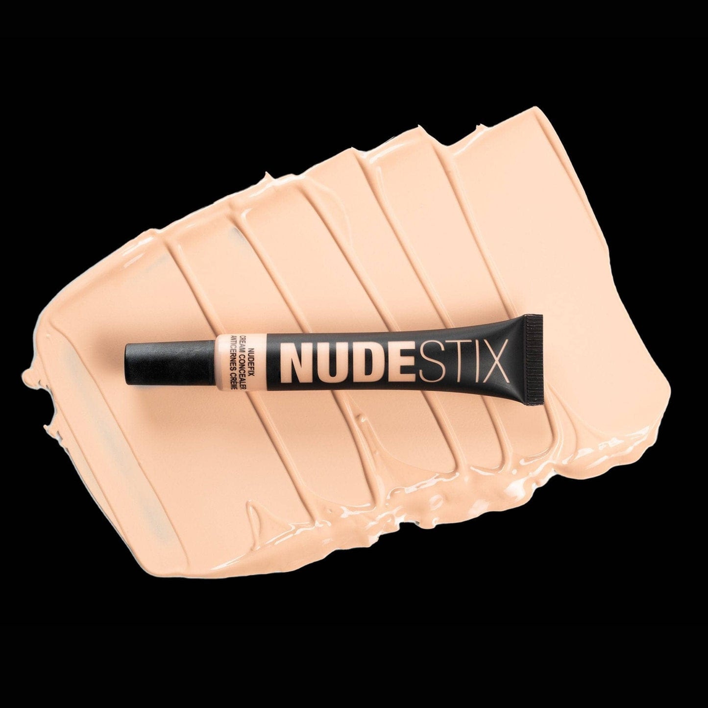 Nudefix cream concealer in shade nude 2 on top of texture swatch