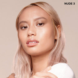 young woman wearing Nudefix cream concealer in shade nude 3