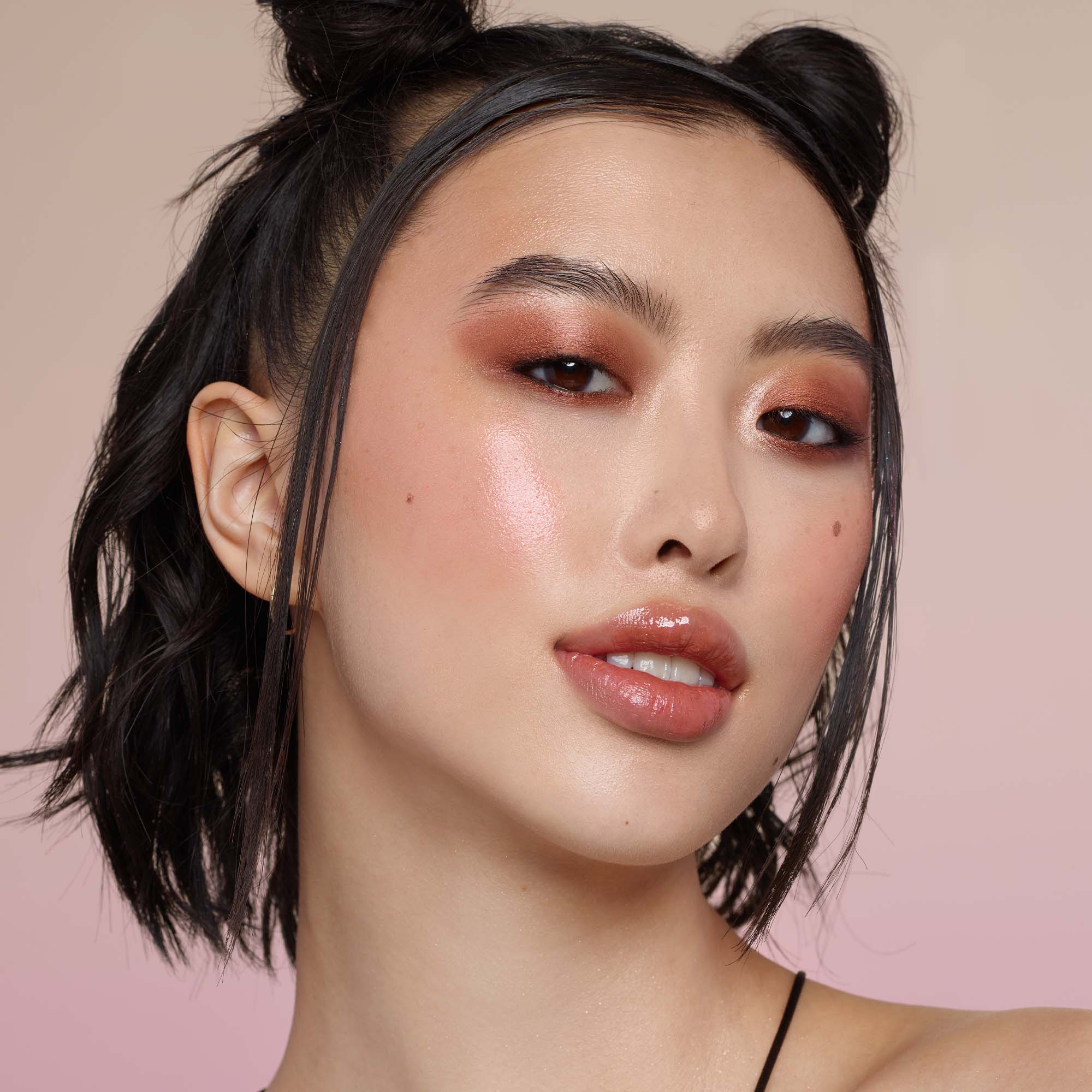 Asian young woman with glowy metalic makeup