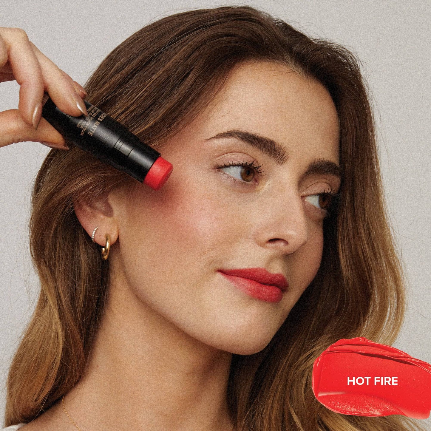 Taylor Frankel wearing Nudies Blush Stick in shade Hot Fire