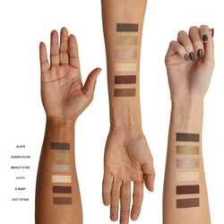 Three arms with swatches of Nude Earth Eye Palette