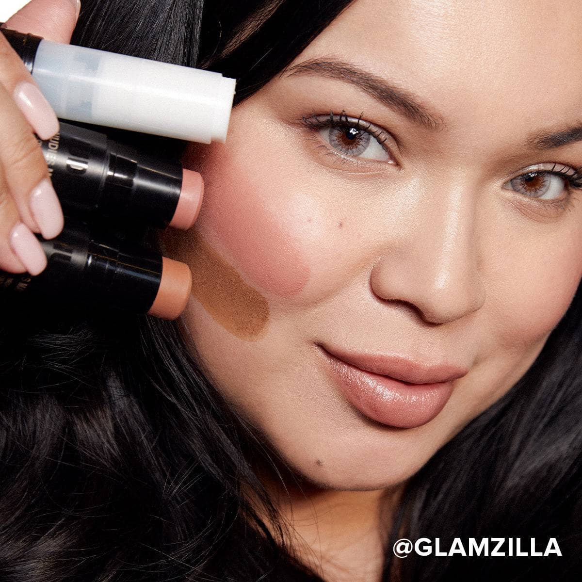 Glamzilla holding No Edit, No Filter, Just Glam sticks