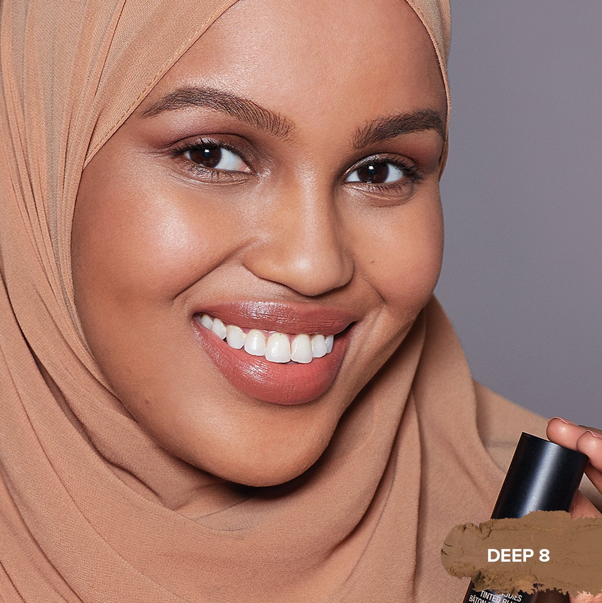 Woman wearing Tinted Blur Foundation Stick in shade Deep 8