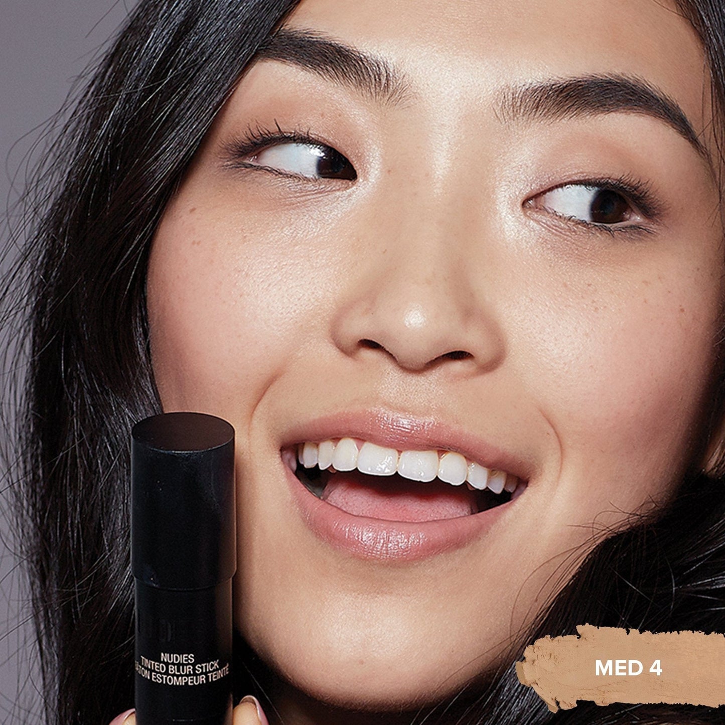 Asian young woman wearing a Tinted Blur Foundation Stick in shade Medium 4