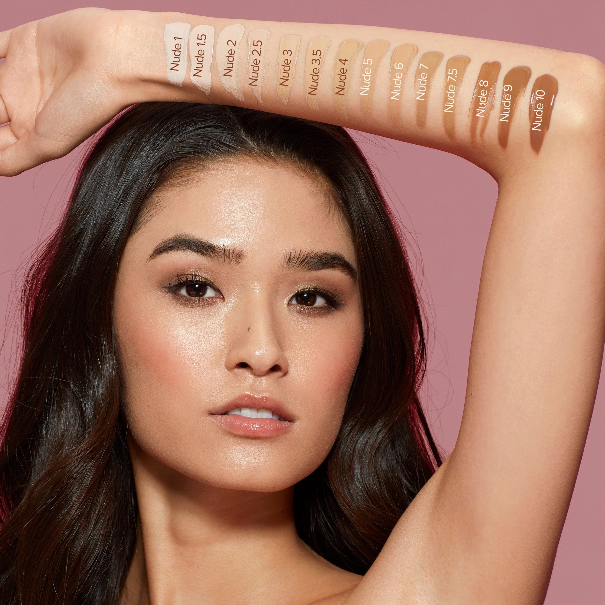 Mixed race young woman with shade Nude 2.5 swatch in her arm