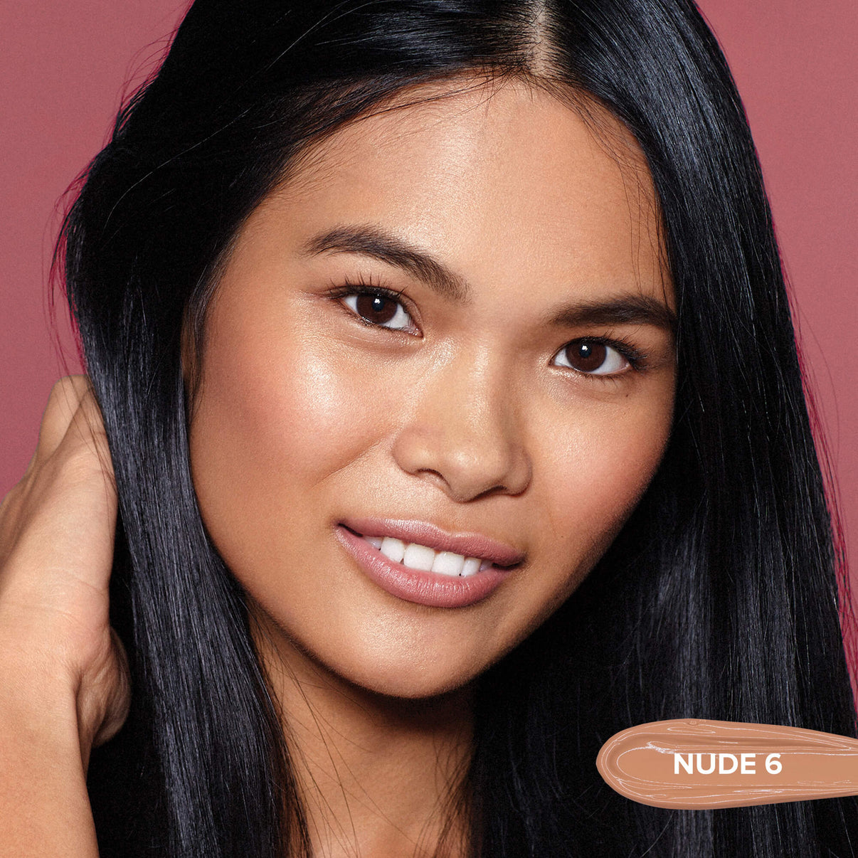 Young woman wearing Tinted Cover Liquid Foundation in shade nude 6