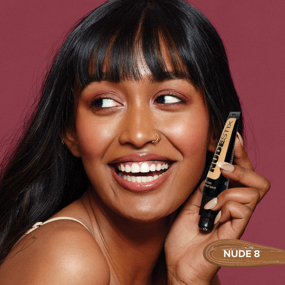 Young woman wearing Tinted Cover Liquid Foundation in shade nude 8