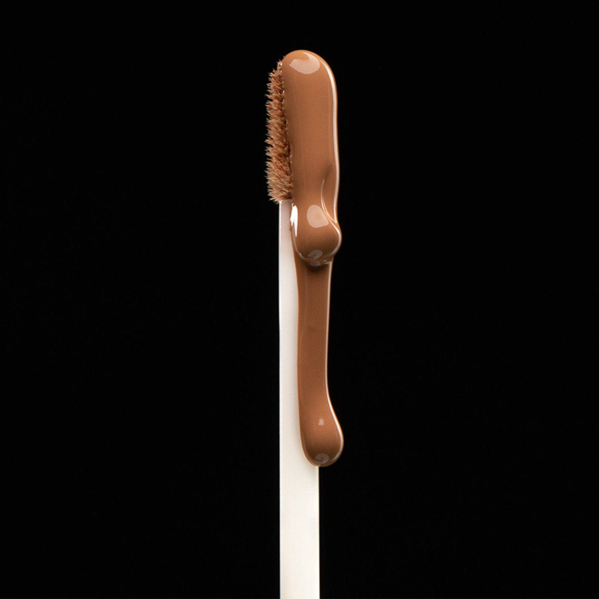 Nudefix cream concealer in shade nude 5.5 brush with product