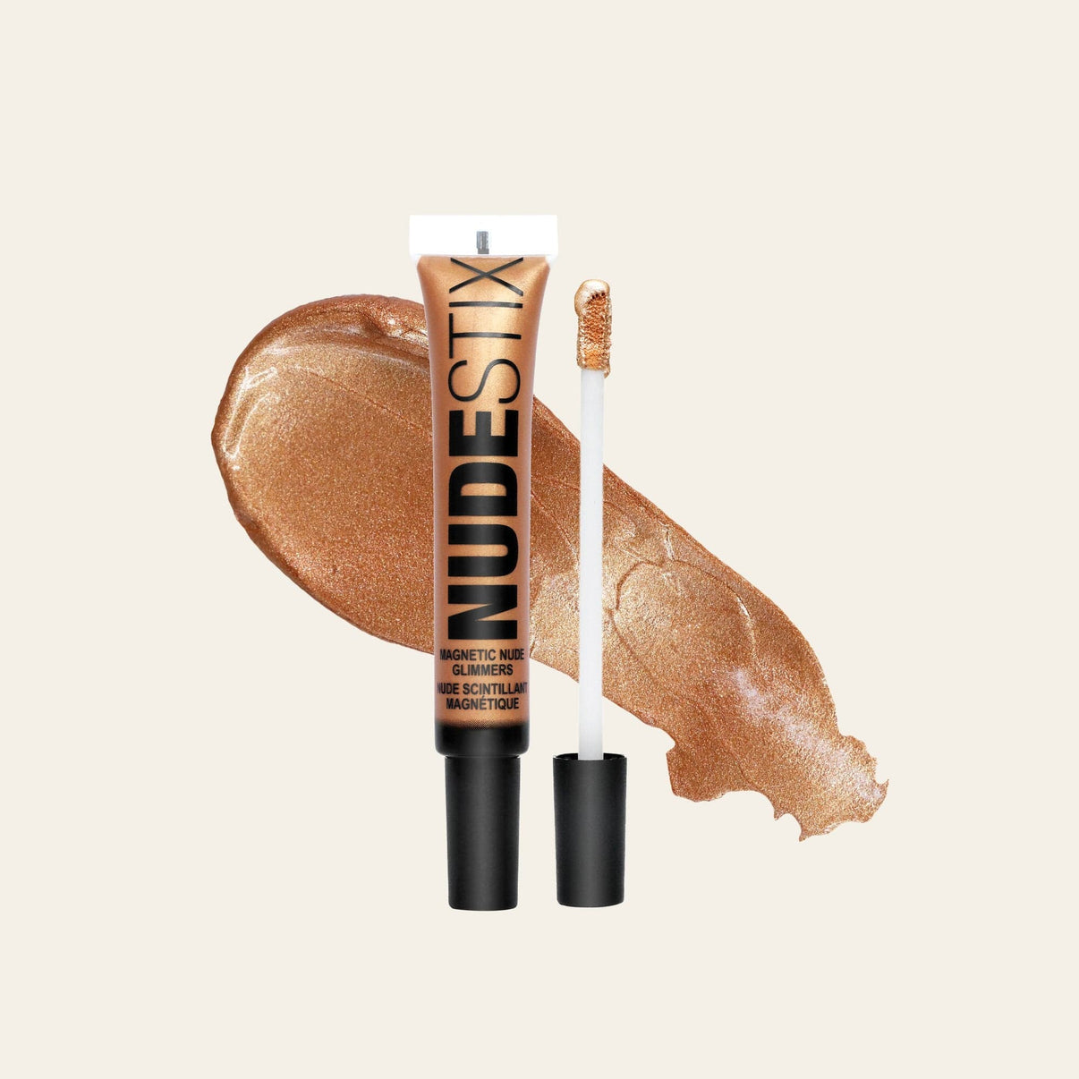 Magnetic Nude Glimmers Liquid Highlighter in shade bronzi babe with texture swatch