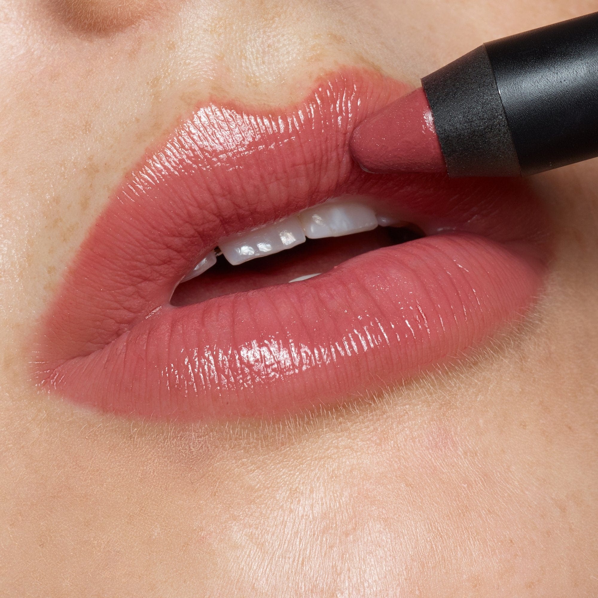 Lips applying Gel Color Lip and Cheek Balm in shade pulse