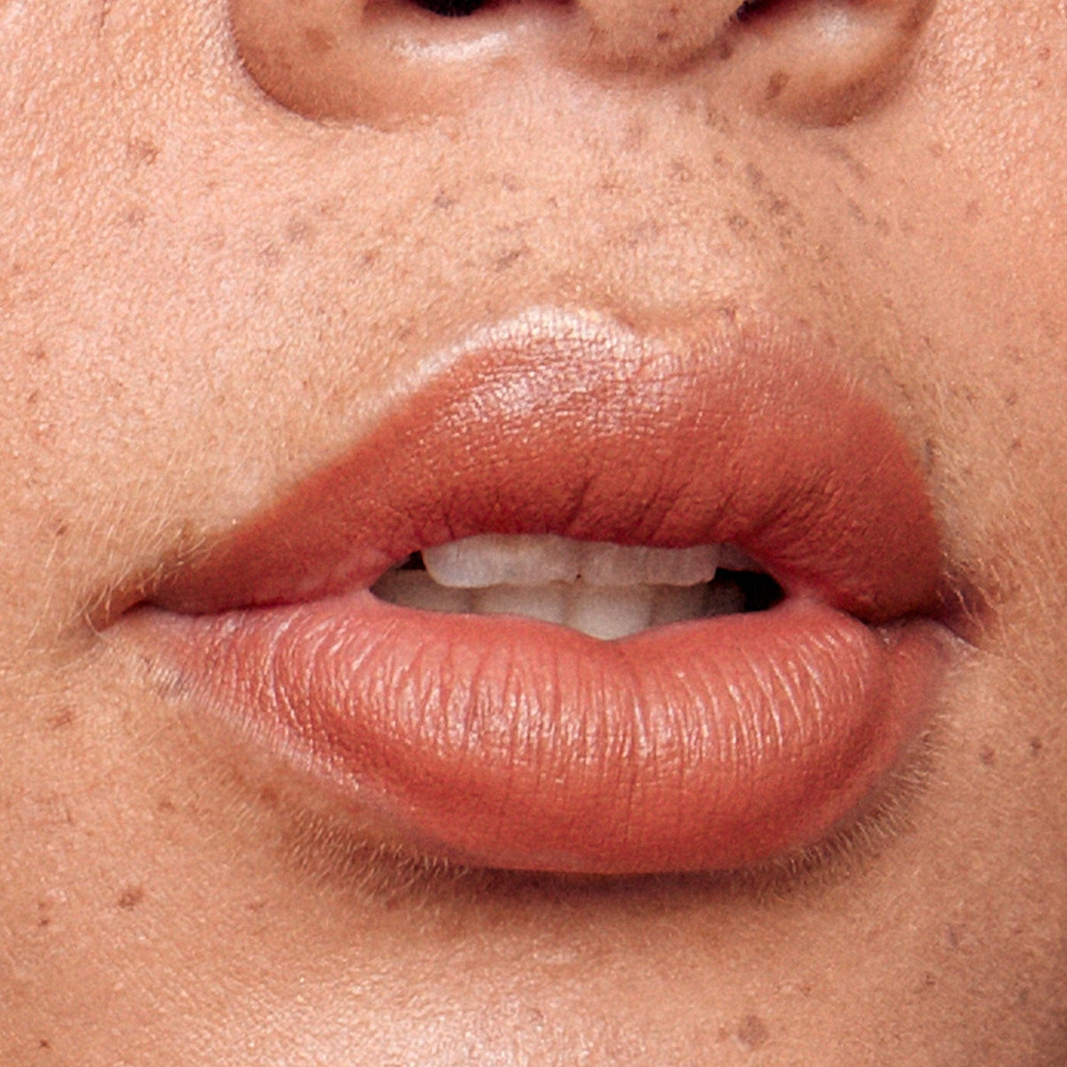 Lips wearing Intense Matte Lip + Cheek pencil in shade fringe