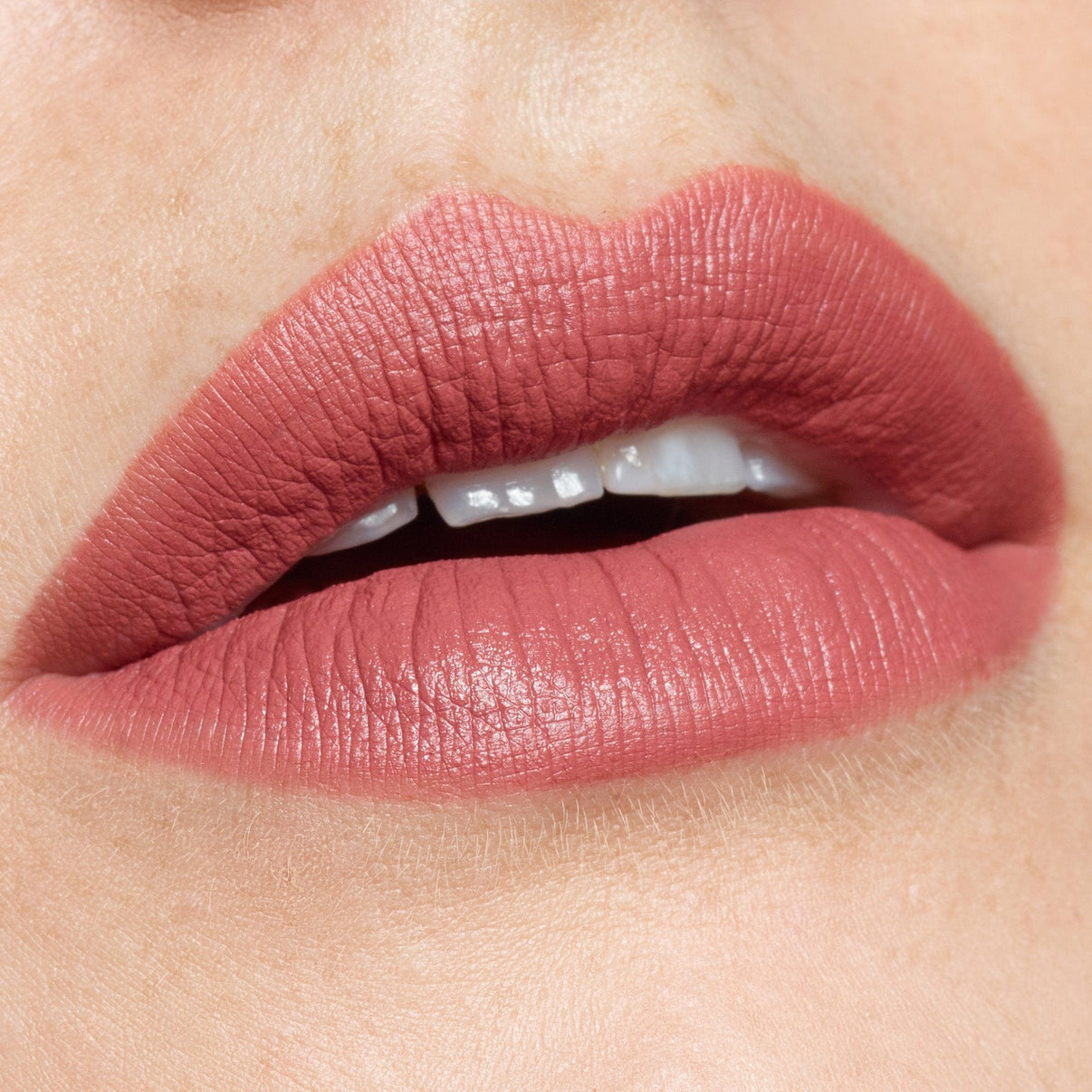 lips wearing Intense Matte Lip + Cheek pencil in shade purity