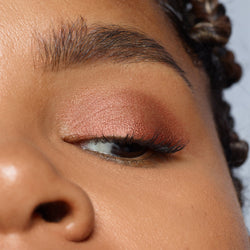 Dark skinned woman wearing Magnetic Eye Color in shade rustique-74