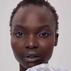 Dark skinned young woman wearing Magnetic Eye Color in shade Lilac Sky - 128