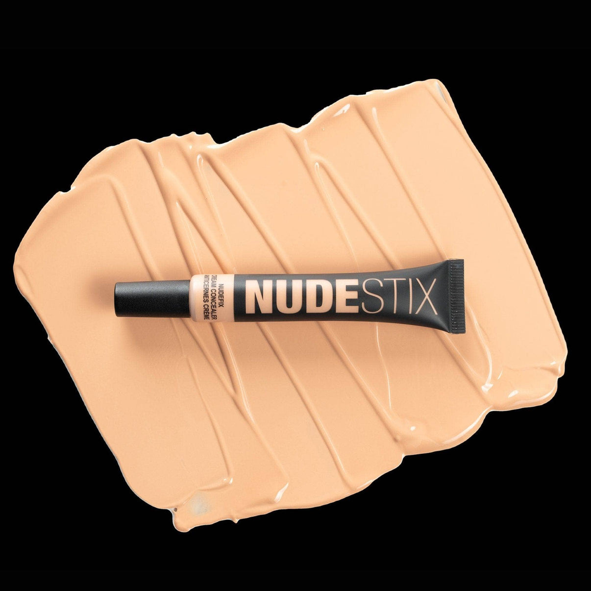 Nudefix cream concealer in shade nude 4 on top of texture swatch