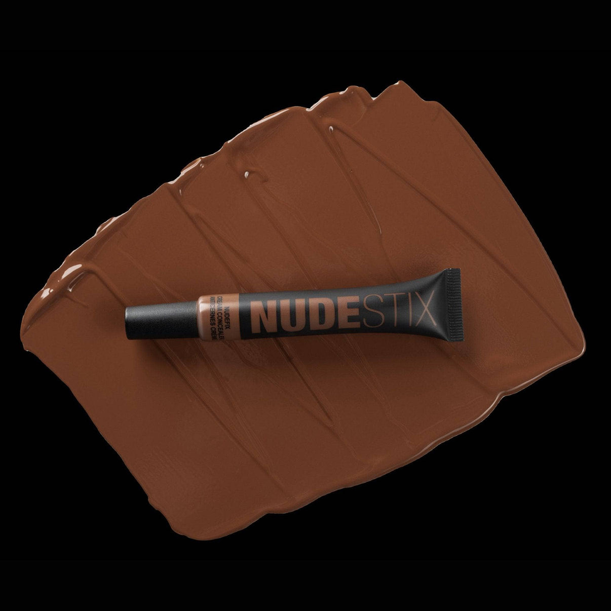 Nudefix cream concealer in shade nude 10 on top of texture swatch