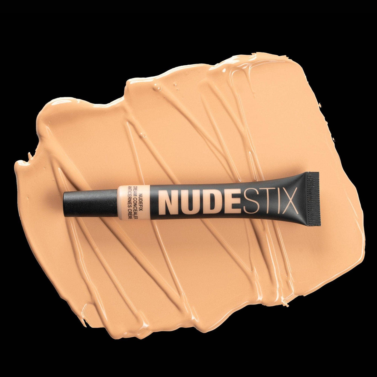 Nudefix cream concealer in shade nude 4.5 on top of texture swatch