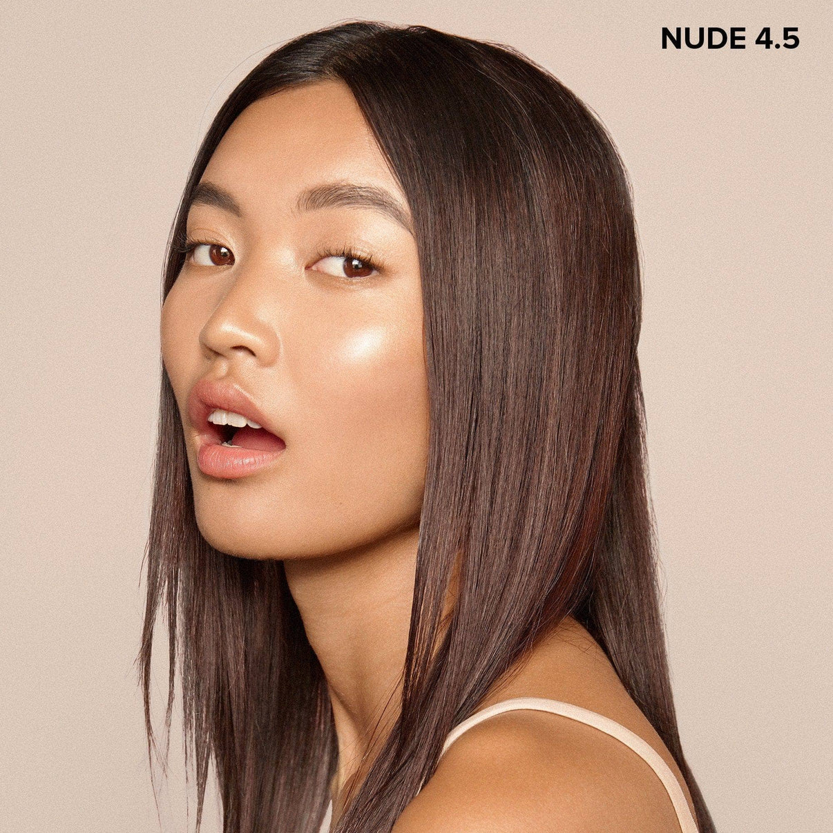 Young woman wearing Nudefix cream concealer in shade nude 4.5