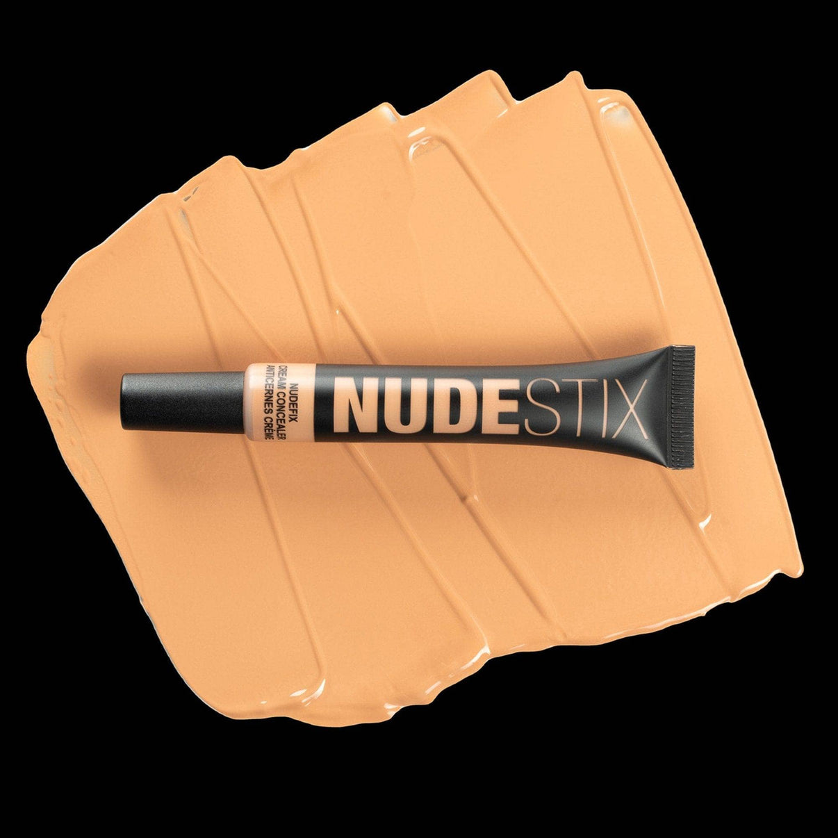Nudefix cream concealer in shade nude 5.5 on top of texture swatch