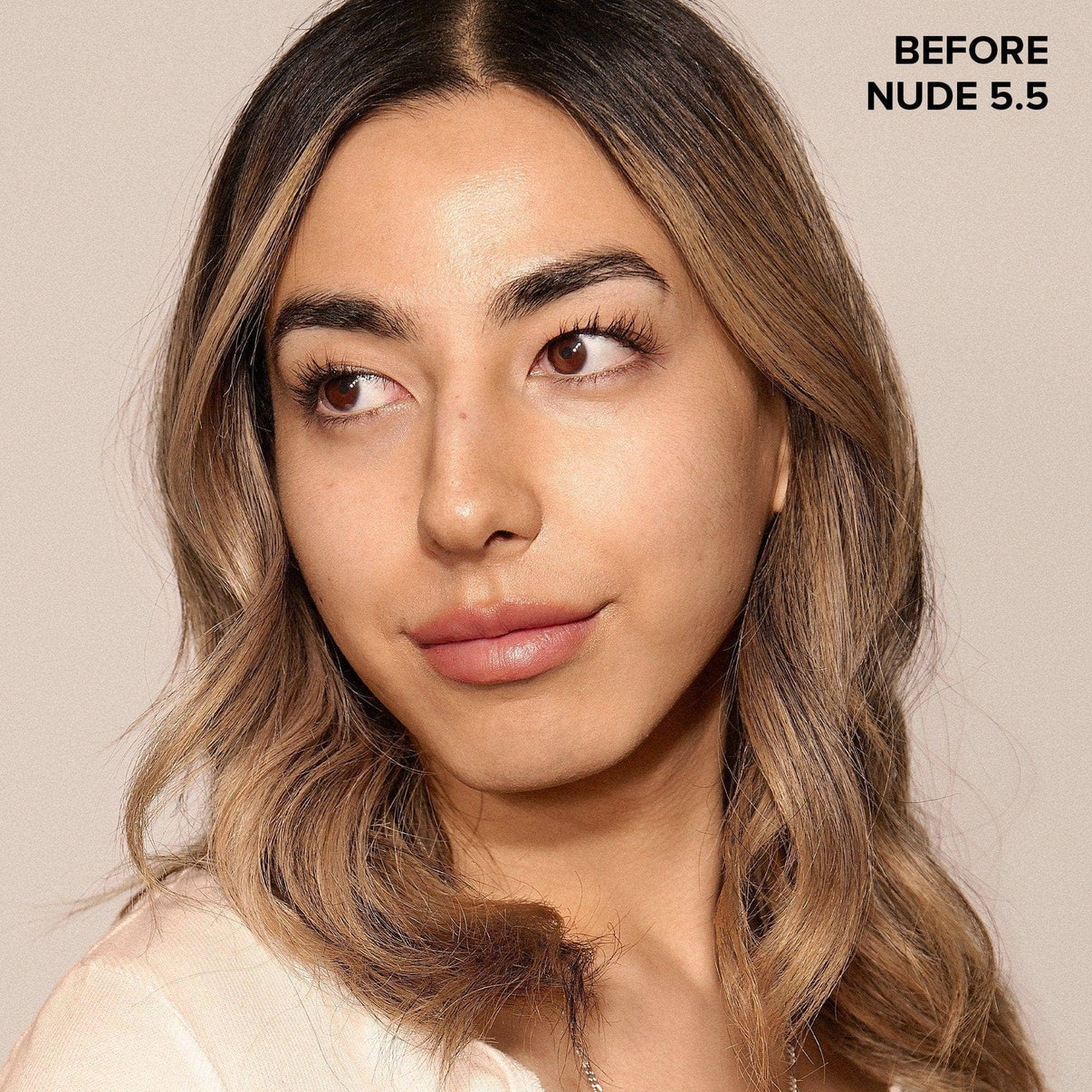 Young woman before wearing Nudefix cream concealer nude 5.5