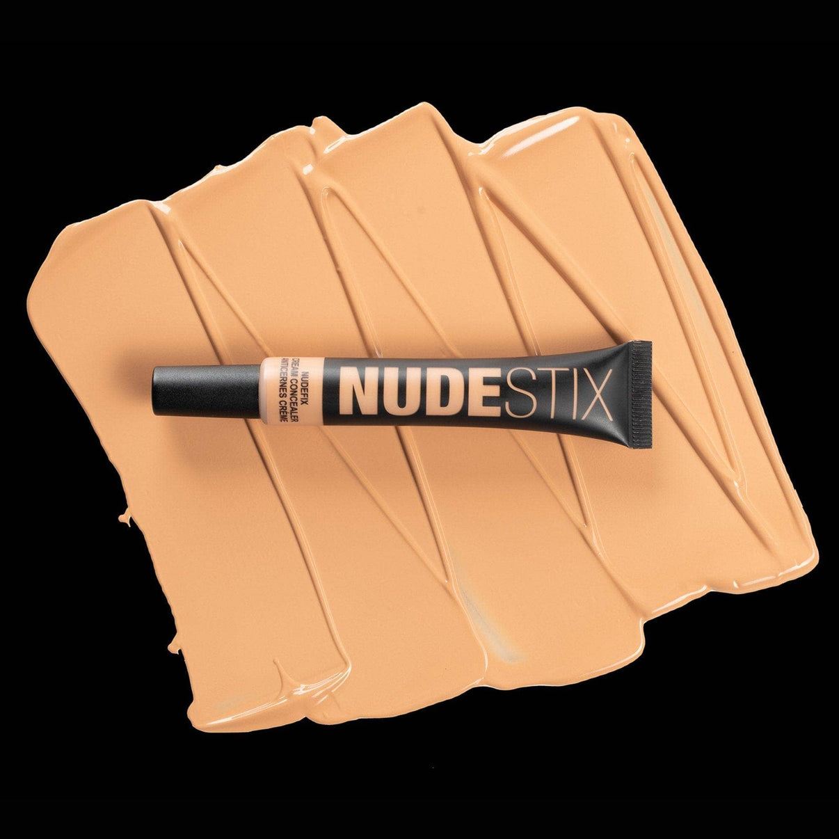 Nudefix cream concealer in shade nude 5 on top of texture swatch