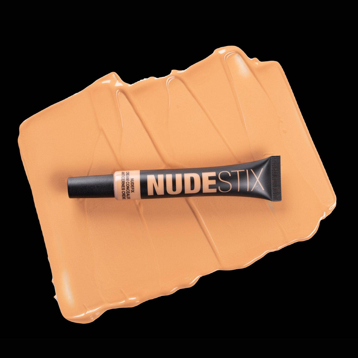 Nudefix cream concealer in shade nude 6 on top of texture swatch