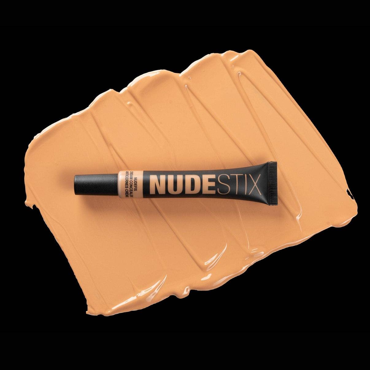 Nudefix cream concealer in shade nude 7 on top of texture swatch