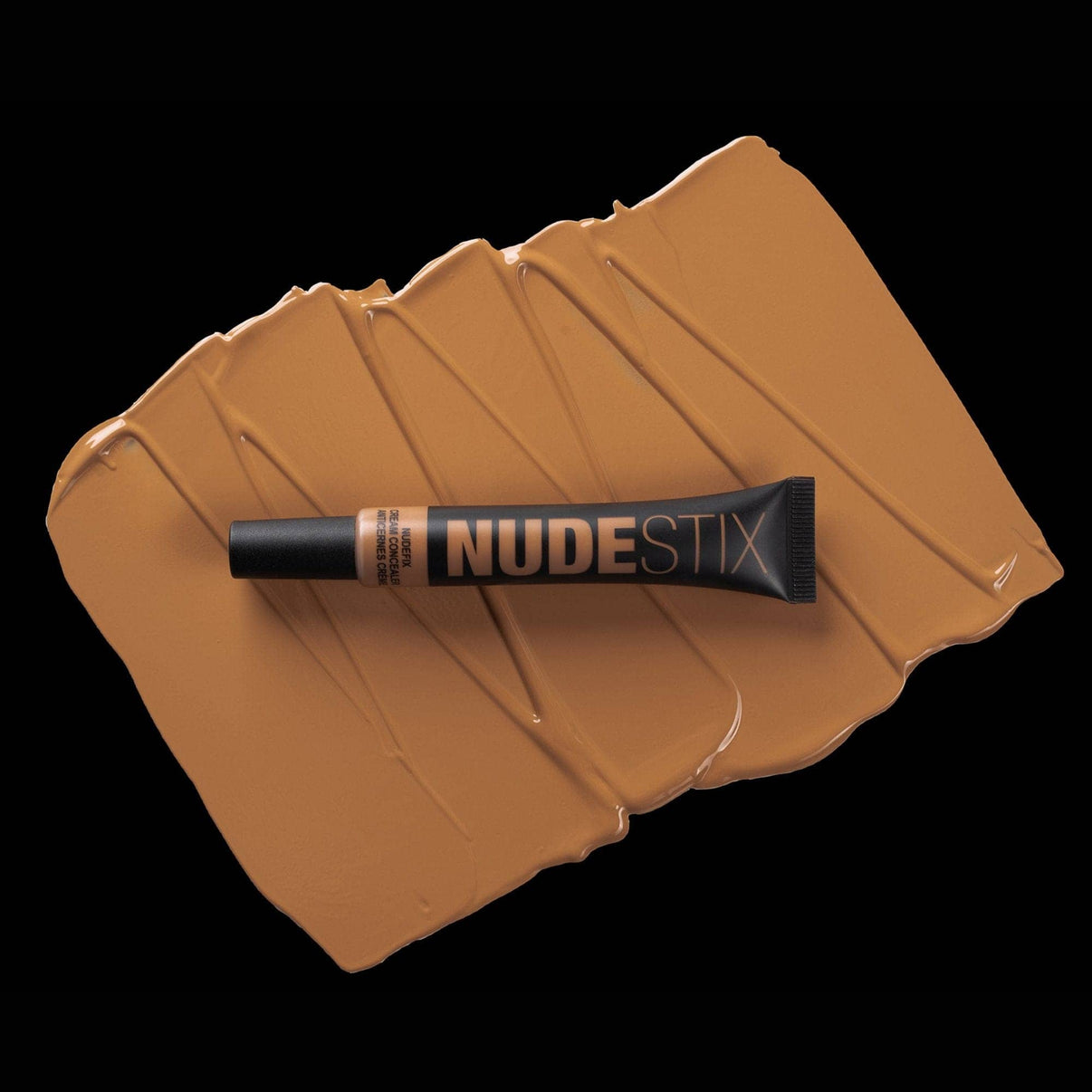 Nudefix cream concealer in shade nude 9 on top of texture swatch
